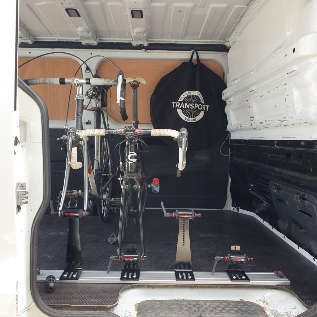 Bicycle carrier rack mounted on wooden floor with wing knobs