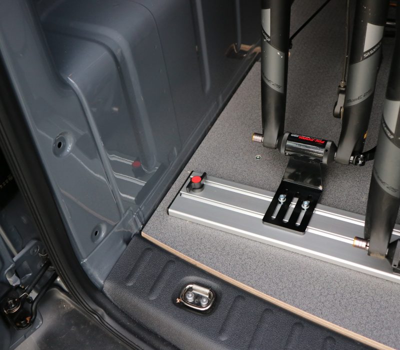 Bicycle Carrier on wooden floor in VW Caddy for 2 E-bikes